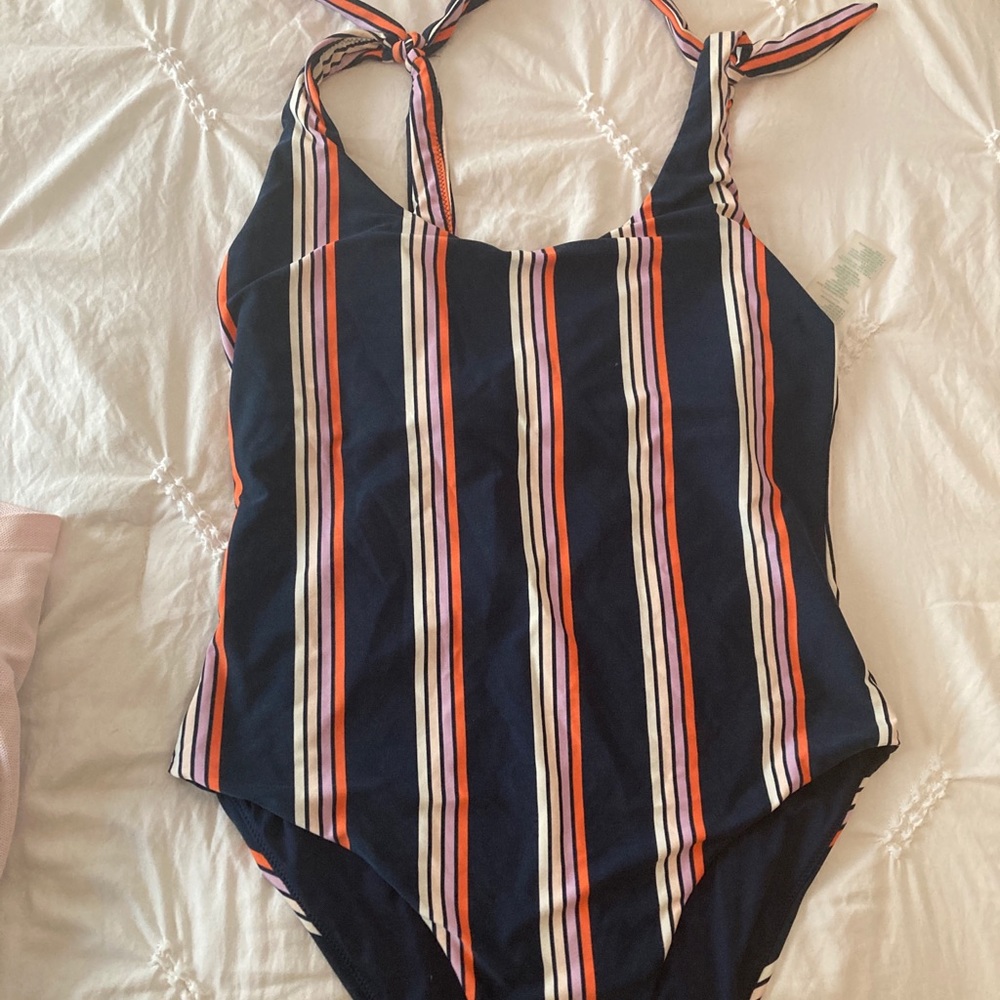 One-piece swimsuit by Carve designs.
